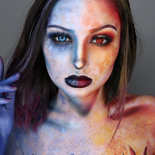 Kent State student Carrie Esser poses in her self-painted body paint. 
