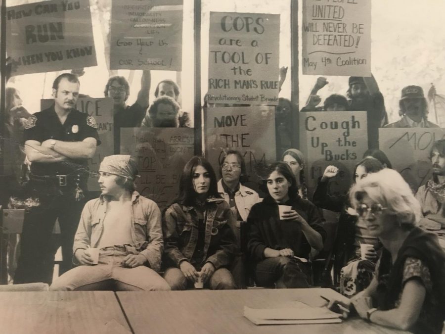 Our May 4 Coalition who occupied Blanket Hill for 62 days in 1977 to protect the May 4 site from destruction — protesting at a Board of Trustees meeting to demand they move the gym, Chic Canfora said.