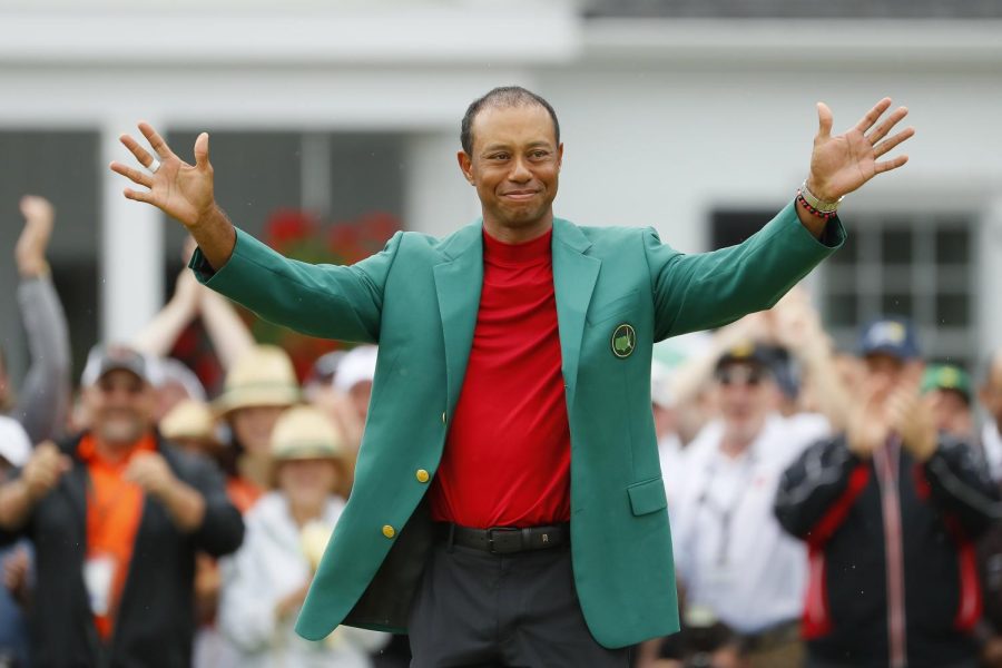 Tiger Woods of the United States smiles after being awarded the Green Jacket during the Green Jacket Ceremony after winning the Masters at Augusta National Golf Club on April 14, 2019 in Augusta, Georgia.