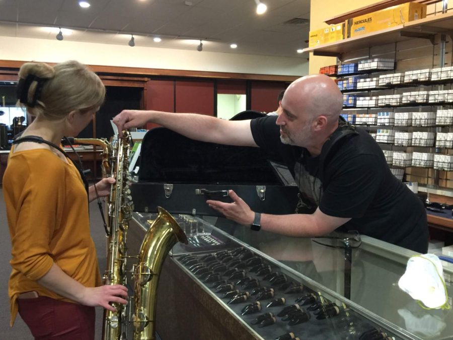 Woodsys Music Staff Helping a Customer in the new 118 E. Main St. Location.