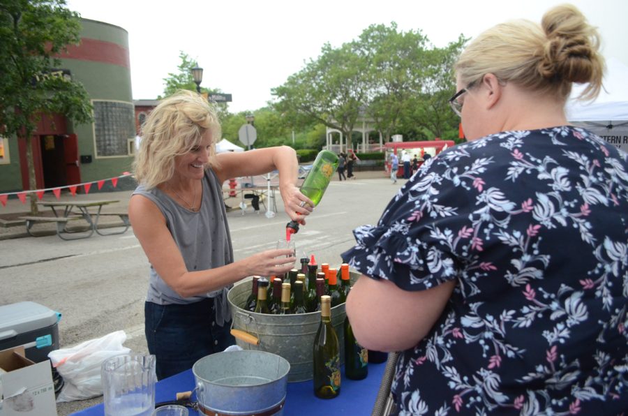 Nautivine Winery pours a sample of their apricot wine during Main Street Kents Wine & Art Festival held downtown on June 1, 2019.