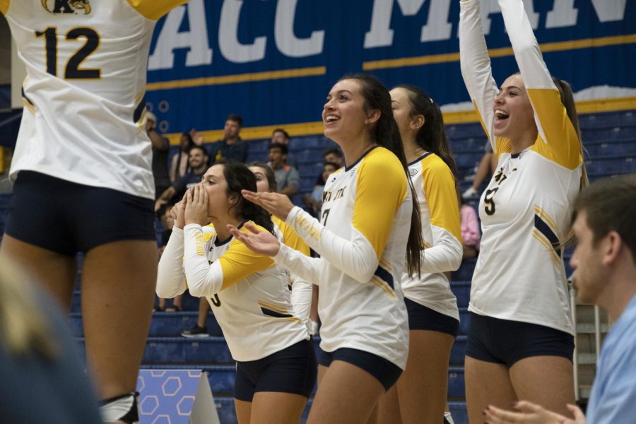 Golden+Flashes+celebrate+scoring+a+point+after+a+rally+in+their+first+game+against+Valparaiso.+Kent+State+defeated+Valparaiso+3-2+on+Friday%2C+September+6%2C+2019.