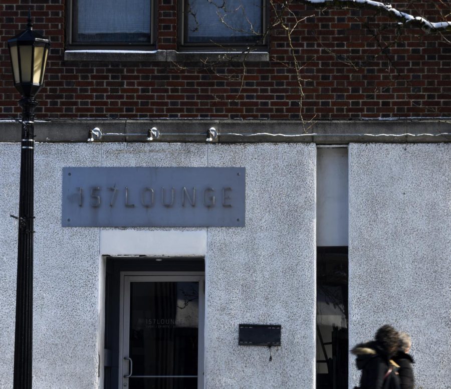 Pedestrians walk past 157 Lounge on South Water Street in downtown Kent on Sunday, Jan. 13, 2018.
