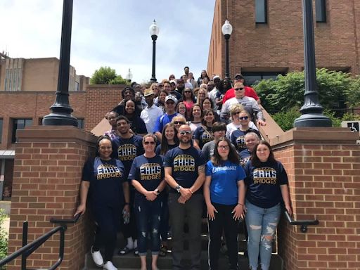 Previous Bridges Summer Program participants and their families stand together at the steps of the Kent State University Student Center. Courtesy of Daniel Nilsson. 