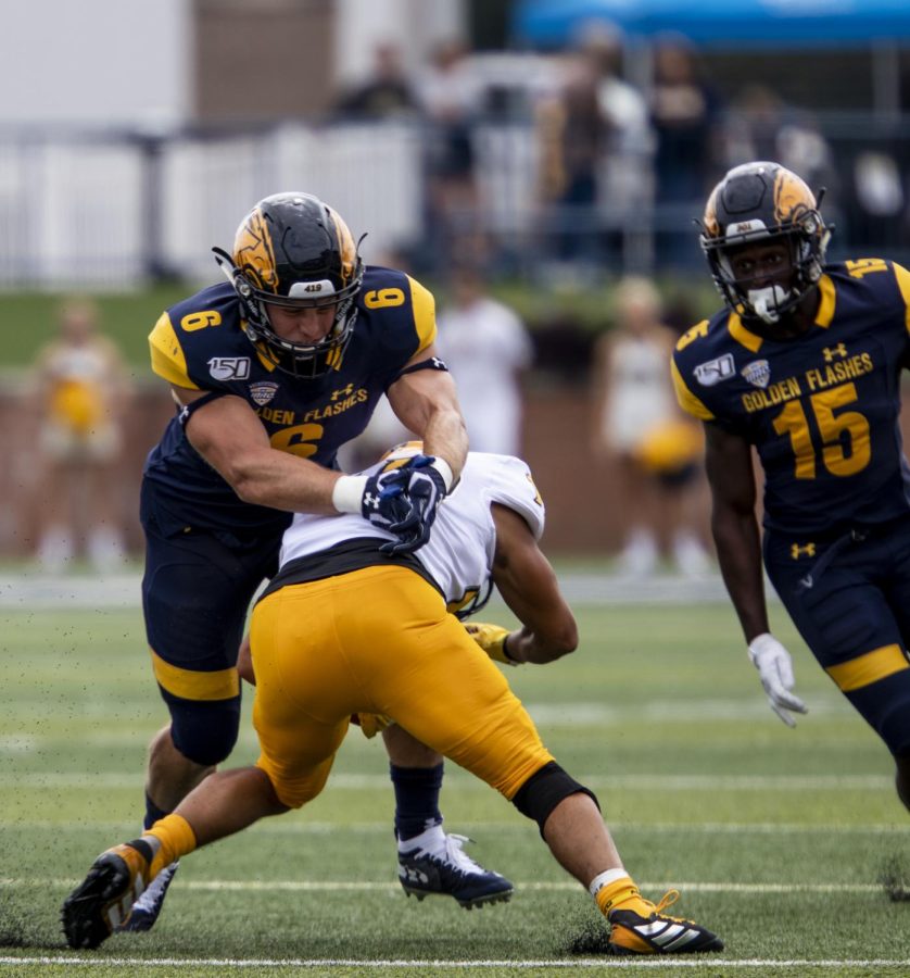 Graduate linebacker Matt Bahr tackles a Kennesaw State University player in Kent States first home game on Saturday, September 7, 2019. The Flashes beat Kennesaw State 26-23 in overtime.