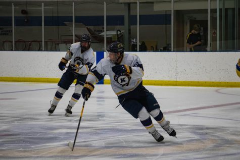Players Nathaniel Schwartz and Nate Butkowski skate to intercept the puck in an attempt to make a goal during The Kent vs. Pittsburgh Game on Sept. 28, 2019. Kent State lost the game 2 to 5.