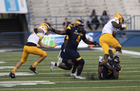 Senior cornerback Jamal Parker tackles running back TJ Reed during Kent States first home game against Kennesaw State University on Saturday, September 7, 2019. The Flashes beat Kennesaw State 26-23 in overtime.