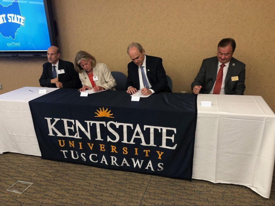 From left: Frank Rose, Jr. (chairman of the district board of trustees); Sally O’Donnell (secretary and fiscal officer of the district board of trustees); Kent State University President Todd Diacon; Board of Trustees chair Ralph Della Ratta. 