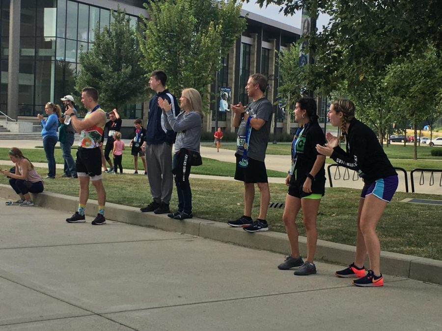 Spectators cheer on runners at the Run the World 5k on Saturday, September 7, 2019. 