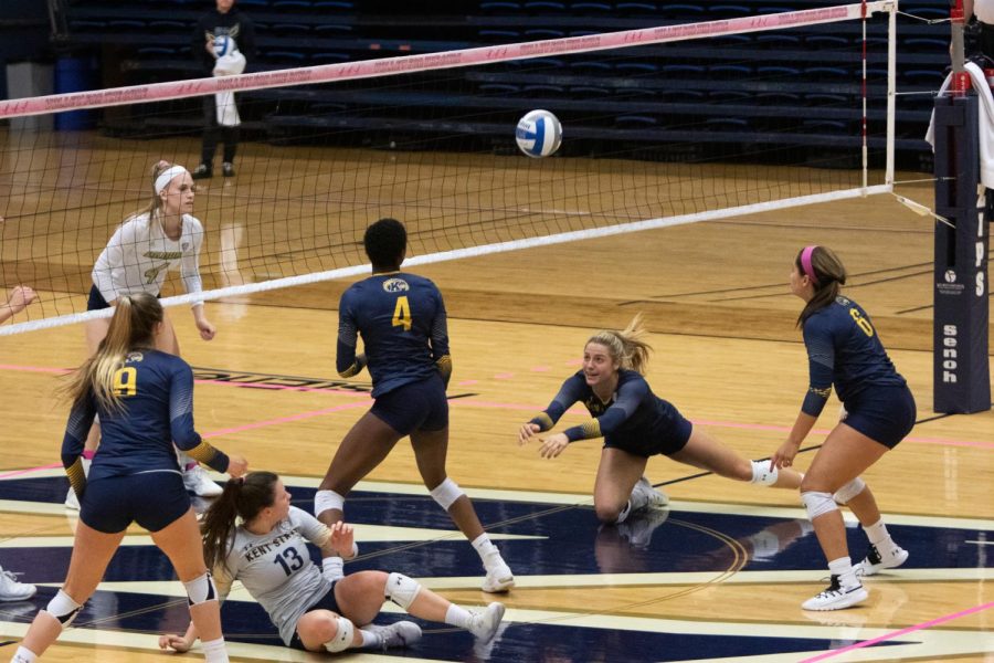 Kent+Setter+Natalie+Tagala+pops+a+ball+back+into+play+during+the+third+set+against+Akron.