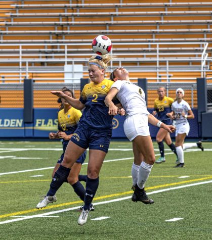 Senior defender/forward Maddie Lavigna heads the ball during Kent States game against the University of Toledo on Sunday, Oct. 6, 2019.