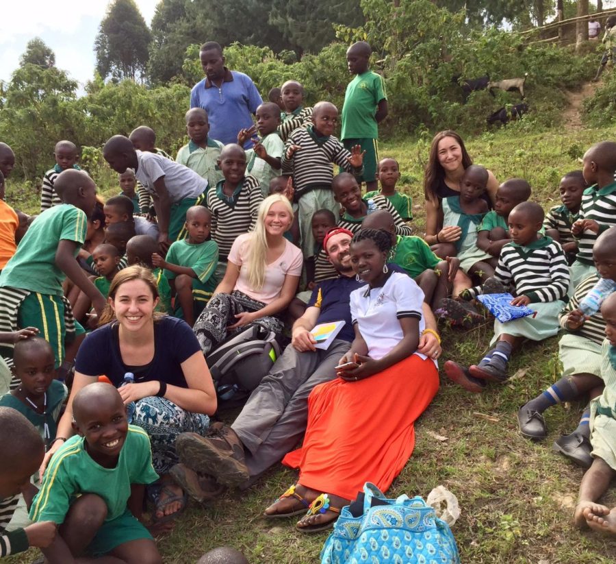David Sharp and a group of Kent State students and sit on top of a mountain overlooking Lake Mburo National Park in Uganda in 2017.