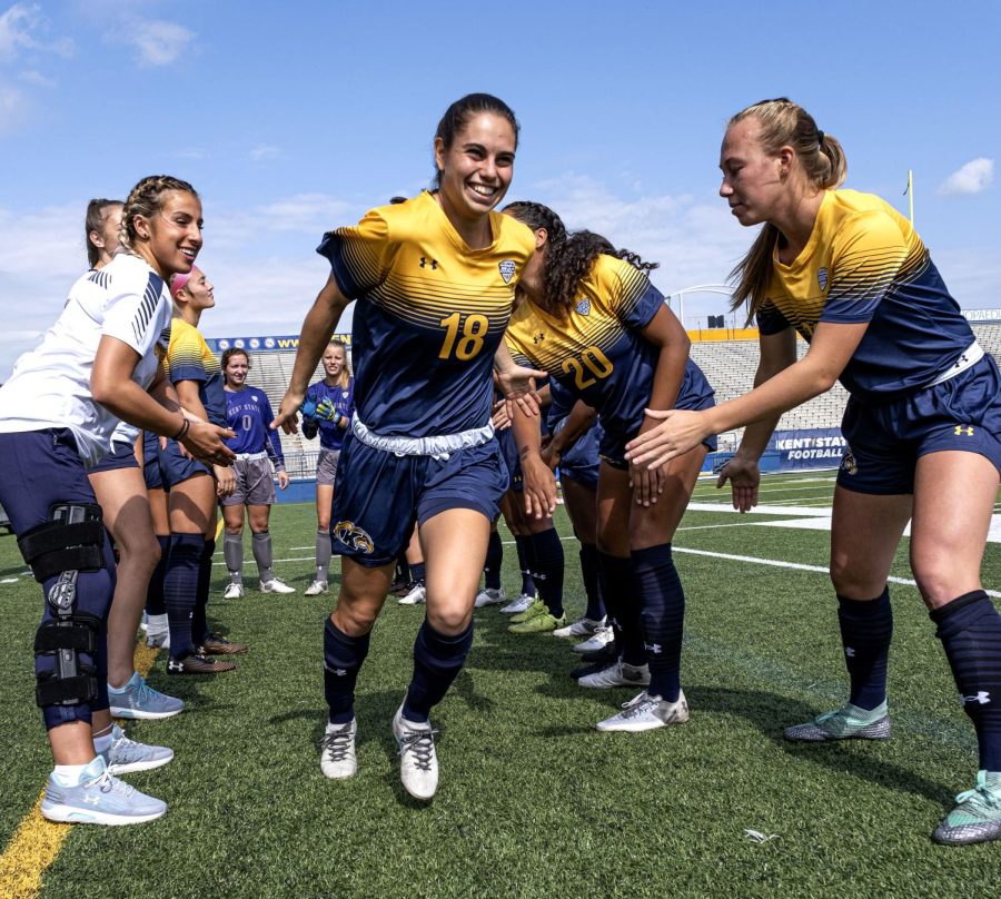 Junior+midfielder+Vital+Kats+high+fives+teammates+while+she+runs+onto+the+field+before+the+game+against+the+University+of+Toledo+begins+on+Sunday%2C+Oct.+6%2C+2019.