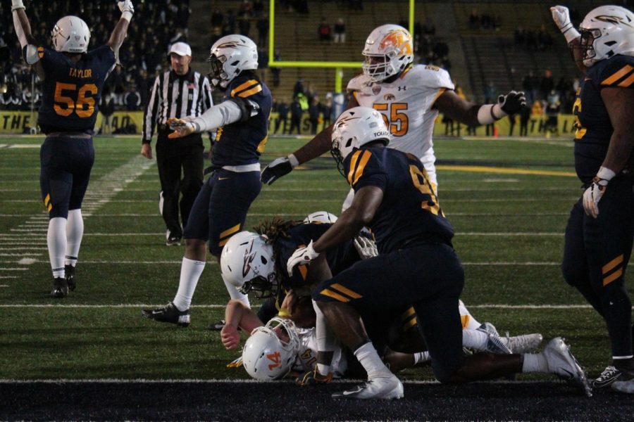 Junior quarterback Dustin Crum (14) is stopped inches short of the game tying two-point conversion on Nov. 5 2019 at Toledo. Kent State went on to lose 35-33.