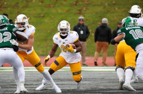 Joachim Bangda (21) carries the ball during Kent States 36-28 win over Eastern Michigan on Nov. 29, 2019. He finished the game with 11 carries for 51 yards. 