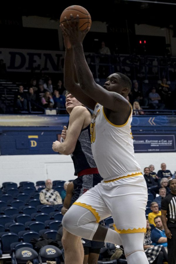Kalin Bennet, freshmen center, rebounds the ball during Kent States game against Hiram College on Wednesday, November 6, 2019.