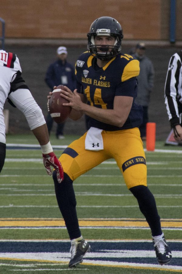 Dustin Crum, a junior quarterback, prepares to throw the ball to a teammate during the football game on Nov. 23, 2019. The Golden Flashes beat Ball State University 41-38.