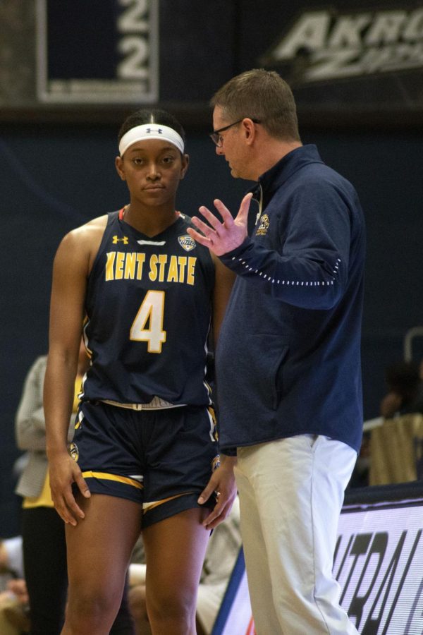 Freshman+Nila+Blackford%2C+4%2C+talks+to+her+coach+Todd+Starkey+during+a+free+throw+in+the+womens+basketball+game+against+Purdue+Fort+Wayne.+The+Golden+Flashes+beat+Purdue+Fort+Wayne+75-67+in+the+Akron+Classic+on+Nov.+16%2C+2019.