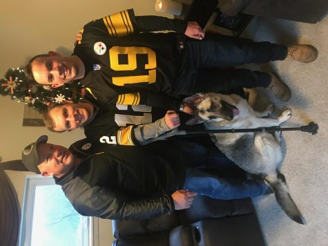 Dad, Mitchell, and I by the Christmas tree before we headed to Pittsburgh for the game. Our dog Bell even decided to join in. 