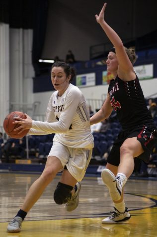 Freshman guard Katie Shumate (14) goes for a layup during the womens basketball game on Jan. 29, 2020. Kent State Univeristy won against Ball State Univeristy 69-68.