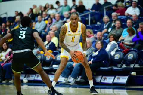 Senior guard CJ Williamson (1) looks to drive past Terry Ivery (3) during Kent States 77-53 win over Stetson on Nov. 30, 2019. Williamson finished with five points in his fourth game back after a broken foot in the offseason. 