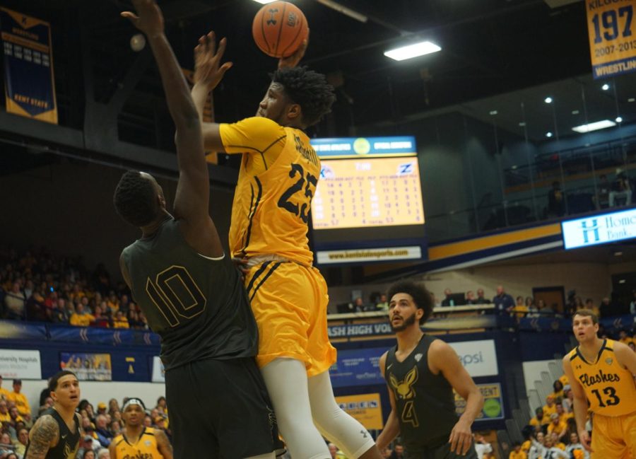 Senior Philip Whittington (25) goes up for a shot against Akron at the M.A.C.C. on Friday, Jan. 31, 2020. Whittington finished with 11 points and grabbed five offensive rebounds. He scored the game-winning layup with 20 seconds left to give Kent State the 68-67 win.