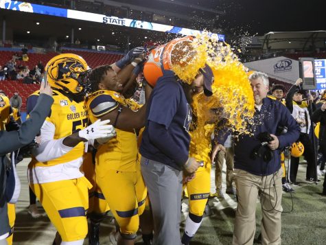 Kent State players dump Gatorade on coach Sean Lewis after beating Utah State 51-41 in the Tropical Smoothie Cafe Frisco Bowl on Dec 19. 2019. 