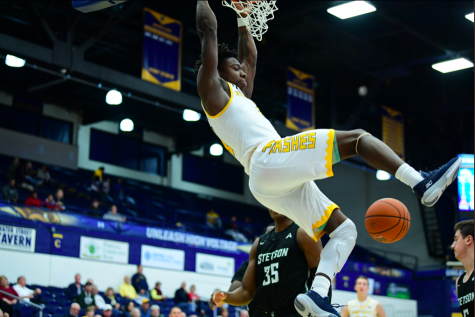 Senior guard Antonio Williams hangs on the rim during Kent States 77-53 win over Stetson on Nov. 30, 2019. He finished with 11 points and five assists. 