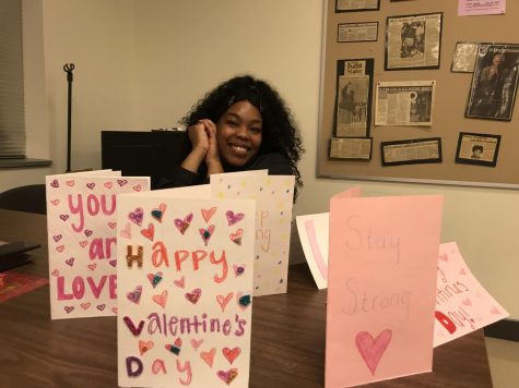 BUS Vice President Qhmaria Monteiro poses with some of the cards made for children with heart disease. Feb. 5, 2020.