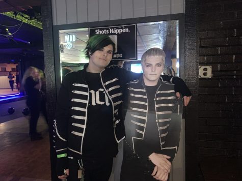 Logan Bates of Akron stands next to a cardboard cutout of Gerard Way, both dressed in the My Chemical Romance marching band uniforms.