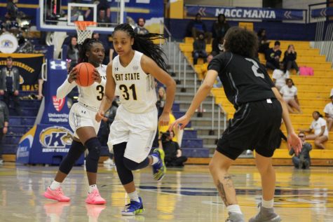 Redshirt Senior Megan Carter (31) passes the ball to Sophomore Asiah Dingle (3) trying to find an opening against Akron on Wed. Feb. 26, 2020. Kent State won 68-50 against the University of Akron. 