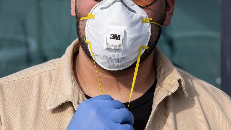 CASALPUSTERLENGO%2C+ITALY+-+FEBRUARY+23%3A+A+man+wearinig+a+respiratory+mask+and+gloves+is+pictured+on+February+23%2C+2020+in+Casalpusterlengo%2C+south-west+Milan%2C+Italy.+Casalpusterlengo+is+one+of+the+ten+small+towns+placed+under+lockdown+earlier+this+morning+as+a+second+death+from+coronavirus+sparked+fears+throughout+the+Lombardy+region.+%28Photo+by+Emanuele+Cremaschi%2FGetty+Images%29
