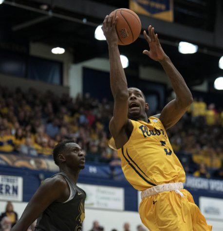 Junior forward Danny Pippen (5) attempts a shot against Akron on Jan. 31, 2020. Kent State University won 68-67, as Pippen scored a game-high 20 points.