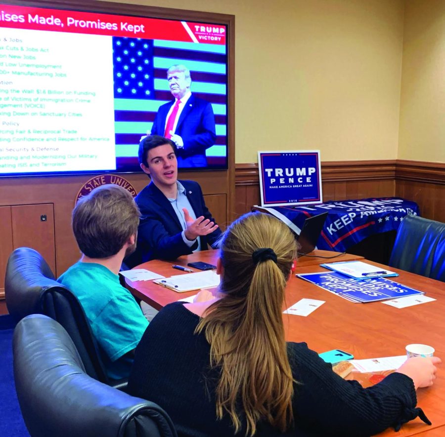 Senior education major Steven Farhart speaks with Vice President Ben Adams, freshman computer science major, and Kameron Griggs, freshman nursing major at the Students for Trump meeting on Feb. 13, 2020. The club is fairly new to Kent State.