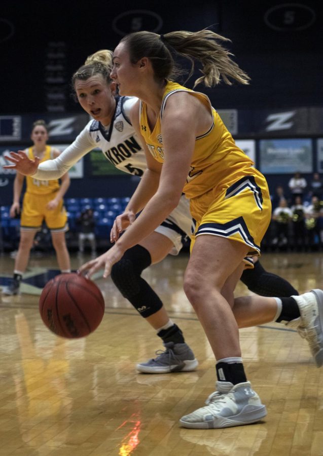 Sophomore guard Hannah Young (32) drives the ball during the women’s basketball game on Feb. 12, 2020 against the the University of Akron. Kent State won the game 60-55.