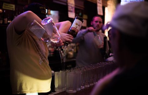 Jake Brenner, bartender at Rays Place, pours drinks in rapid succession during an evening shift on Tuesday, April 16, 2019.