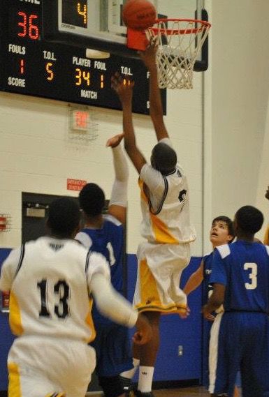 Philip Whittington shoots inside during a ninth grade game for the AAU Hornets. 