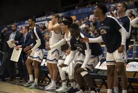 The Flashes bench celebrate during the final minutes of the second half of game against Eastern Michigan on Mar. 9, 2020. Kent State won 86-76 allowing them to move on to the quarterfinals.