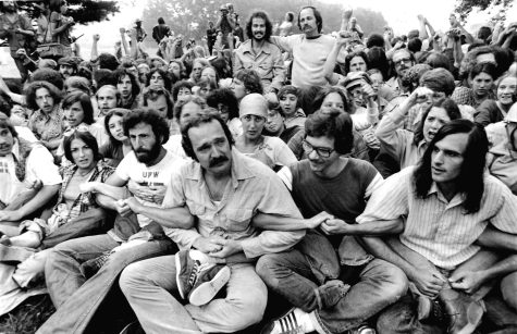 Protesters link arms July 12, 1977, during the Tent City protests at Kent State. An order to disperse was read that morning and 193 people were arrested by unarmed Kent State police officers. Roseanne “Chic” Canfora is at left. 