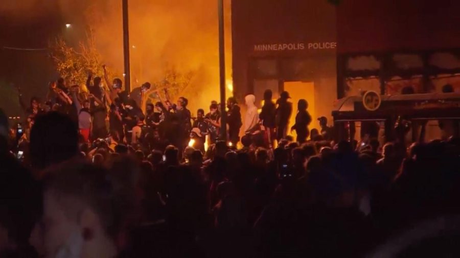 Protesters have set a Minneapolis police station on fire.