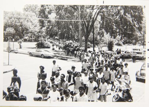 African American high school students march throughout downtown Jackson, Mississippi to protest the May 14-15, 1970 shootings that took place at Jackson State University. City and state police officers opened fire at student protesters outside a womens dormitory, injuring 12 people and killing two, Phillip Gibbs and James E. Green. 