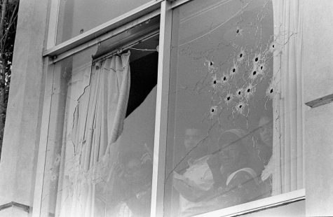 Students peer out of the bullet-riddled windows of Alexander Hall, a womens dormitory at Jackson State College in Jackson, Miss., after two African-American students were killed and 12 injured when police opened fire on the building, claiming they were fired upon by snipers, May 15, 1970. The shooting occurred after rioting broke out on the campus. (AP Photo)