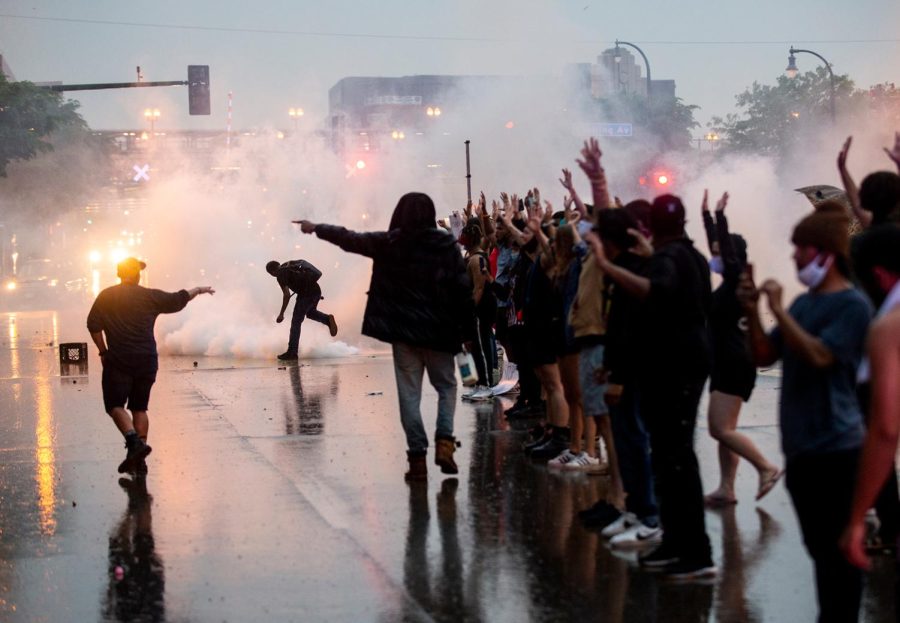 Tear+gas+is+fired+as+protesters+clash+with+police+while+demonstrating+against+the+death+of+George+Floyd+outside+a+police+precinct+on+May+26%2C+2020+in+Minneapolis%2C+Minnesota.%C2%A0