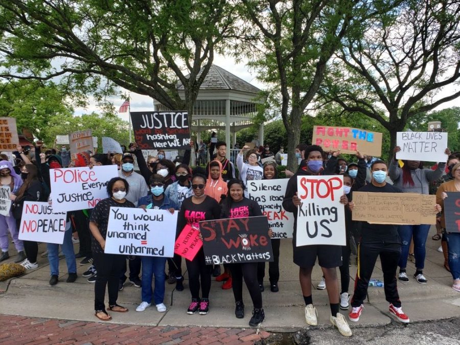 Community members gather at the gazebo on the corner of Franklin Ave. and W. Main St. in downtown Kent Sat. May 30 to support the Black Lives Matter movement, as well as protest the death of George Floyd. The protest was peaceful and there was not a large police presence.