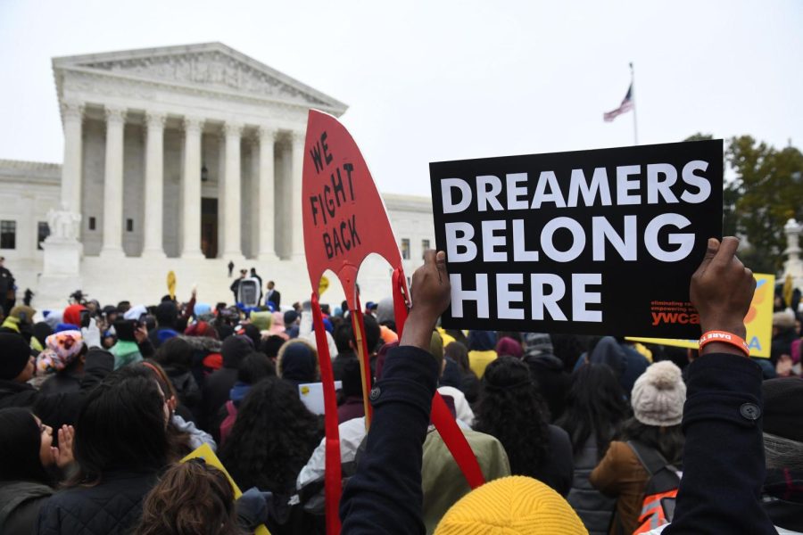 Immigration rights activists take part in a rally in front of the US Supreme Court in Washington, DC on November 12, 2019. - The US Supreme Court hears arguments on November 12, 2019 on the fate of the Dreamers, an estimated 700,000 people brought to the country illegally as children but allowed to stay and work under a program created by former president Barack Obama.Known as Deferred Action for Childhood Arrivals or DACA, the program came under attack from President Donald Trump who wants it terminated, and expired last year after the Congress failed to come up with a replacement. (Photo by SAUL LOEB/AFP via Getty Images)