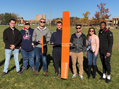 Sydney Bihn (second from right) at a familiarization flight at the start of last years AIAA UAS team at the Kent State soccer fields. Photo Courtesy of Sydney Bihn. 