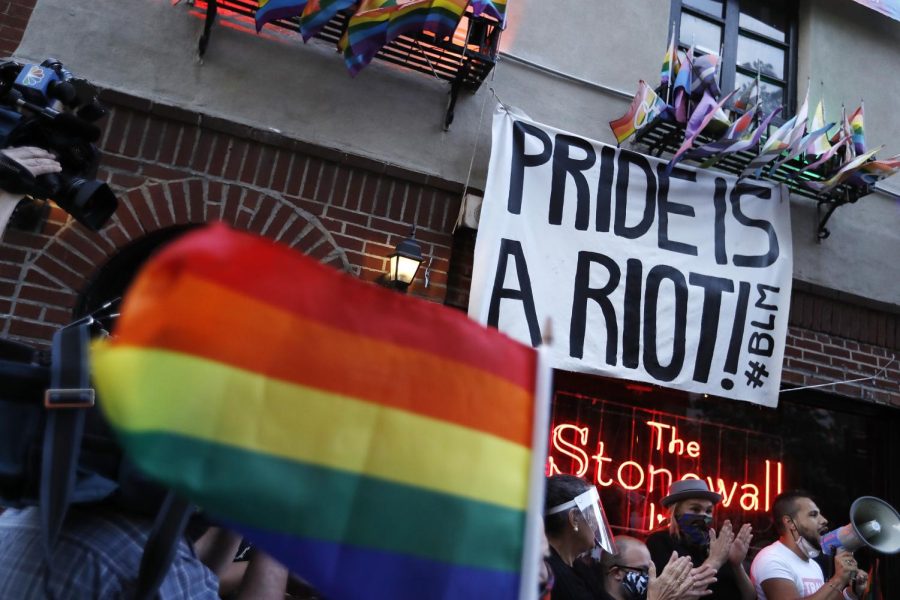 People+gather+at+the+historic+Stonewall+Inn+to+celebrate+the+LGBTQ+victory%2C+in+Greenwich+Village%2C+a+section+of+New+York+City%2C+US+on+6-15-2020+.+A+landmark+6-3+decision+to+protect+%2C+gay%2C+lesbian+and+transgender+workers+from+discrimination%2C+has+passed+today+by+the+Supreme+Court.+The+opinion+written+by+Justice+Neil+Gorsuch+protects+individuals+from+being+fired+based+on+actions+or+traits+that+would+not+have+been+questioned+in+members+of+a+different+sex%2C+according+to+CNN.+%28Photo+by+John+Lamparski%2FNurPhoto+via+AP%29