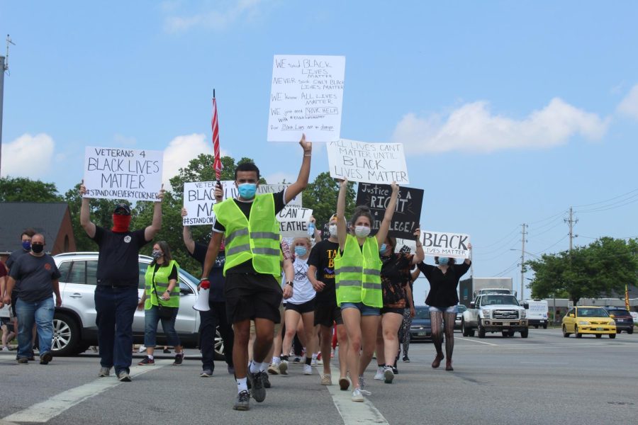After the commemorative silence for George Floyd, the protesters began their march down Darrow road towards The Church in Silver Lake on Kent road.