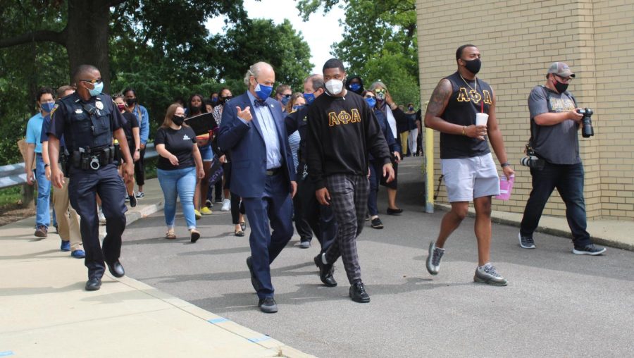 Kent State President Todd Diacon talks and walks with Alpha Phi Alpha fraternity members during a protest on campus Mon., Sept. 14, 2020.
