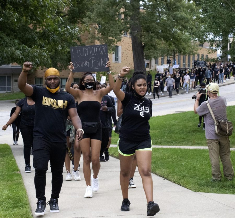 Junior Gabrielle Blake, an officer of Black United Students (BUS) at Kent State University, leads the protesters from Oscar Ritchie Hall to the rock while chanting on Sept. 11, 2020.